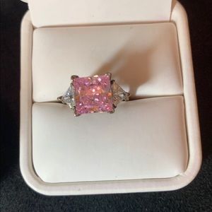 Pink stone set in silver. Feminine. Eye catching.